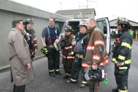 CAPTION FOR PHOTO: Brookhaven Town Supervisor Ed Romaine with some of the firefighters at the scene that day. Romaine pledged a streamlined planning and permit process so rebuilding may commence in Cherry Grove as soon as possible. (Photo courtesy Town of Brookhaven.)