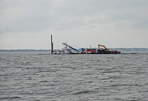 Dredging apparatus being transported on the Great South Bay to open the navigational channel at Watch Hill. (Photograph courtesy NPS / Fire Island National Seashore, December 2014.) 