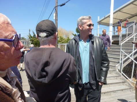 Folks take a moment to unwind and enjoy the sun once the meeting adjourned.
