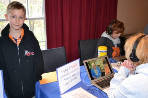 Elijah Finnick was all smiles as he proudly presented his works and those of his classmates to the community. (Photo by Carrie Ann Salvi.)