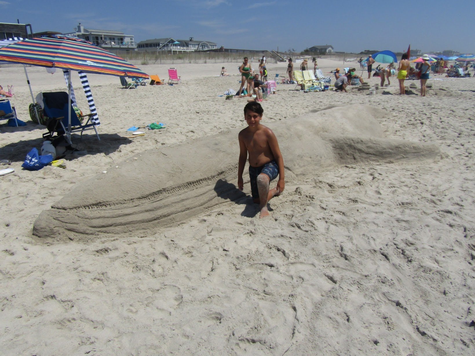 Elliot Gordon and his team created a giant beached whale sculpture named “Whalecome Back!” He started building at 7 a.m. and kept spraying water on the whale to keep the sand intact. (Copy)