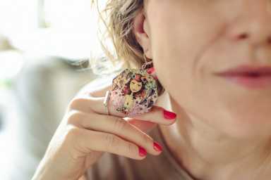 Designer is trying out her selfmade earing