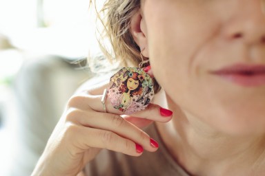 Designer is trying out her selfmade earing