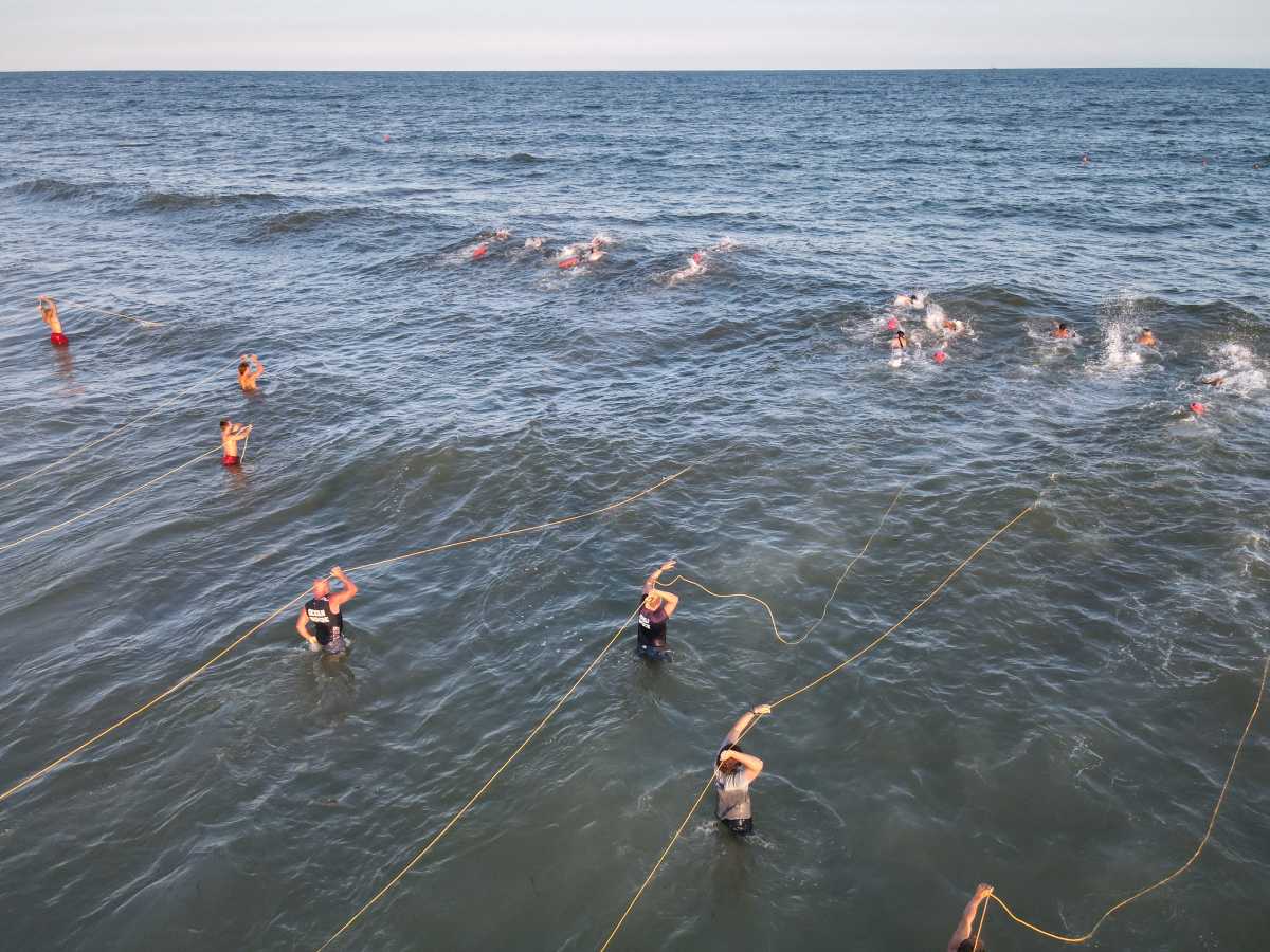 The Fire Island Lifeguard Tournament is always a favorite event to cover. Still, this year, Ocean Beach Police Officer Andrew Becher sent us something a little different – a view from above. A licensed and talented drone operator, Becher's photographs have won Fire Island News journalism awards in past years, and he may do so again, as he caught all the action from a different perspective. This year, the Golden Torpe went to the Town of Islip, a machine that is hard to beat, but Ocean Beach and Saltaire Village have taken home their share over the past summers for sure. The skills of all these brave men and women are evenly matched, making for a competitive and close match every time. It's a sport developed in the interests of saving lives along the water. Congratulations to all!