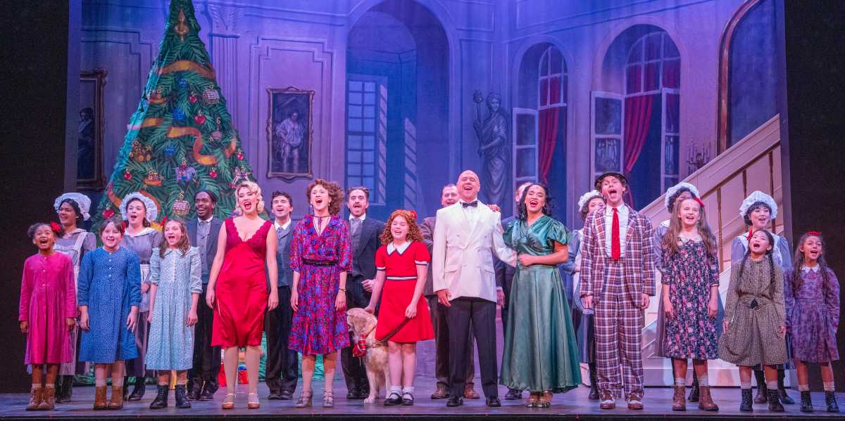 On Sundays in 1962, television host Chuck McCann, would read the New York Sunday News, which featured the cartoon character Little Orphan Annie. He wore white circular discs over his eyes to portray Annie as he read the comic strip aloud. Such an oddity to me back then, those discs affixed to the eyes scared me. It even led me to dislike the Little Orphan Annie comic strip. However, seeing the production of Annie at the Argyle Theatre, directed by Valerie Wright, completely changed my mindset.