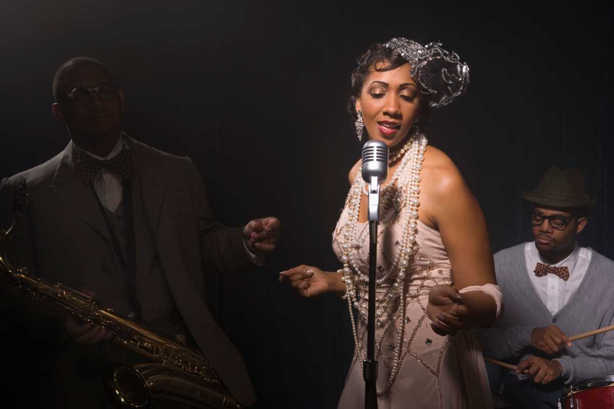 Singer performing with band in nightclub