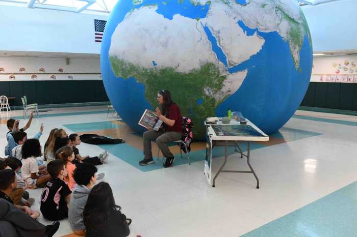 In honor of Earth Day, second-grade students at the Edward J. Bosti Elementary School in Sayville, part of the Connetquot Central School District, participated in the Our Living Planet experience: an interactive educational program featuring a massive inflatable Earth balloon. Students stepped inside the 19-foot-tall sphere, which displays true-to-scale satellite imagery of the planet. Looking at the outside and inside of the balloon, students explored a range of topics, including geography, climate and animal life, offering them a unique, immersive look at Earth’s systems.